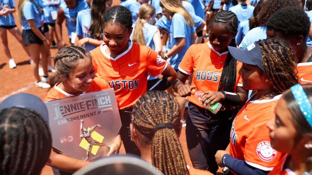 Alina Elias reacts with her team after winning the Jennie Finch Empowerment Award.
