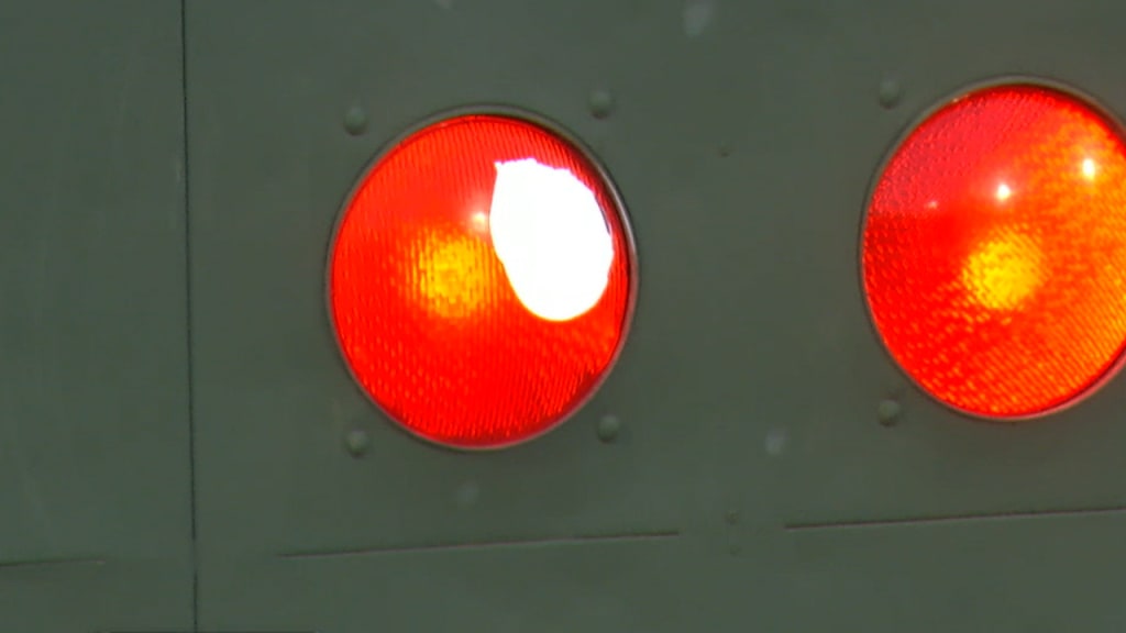 Hit ball gets lodged in red light of Fenway Park's Green Monster