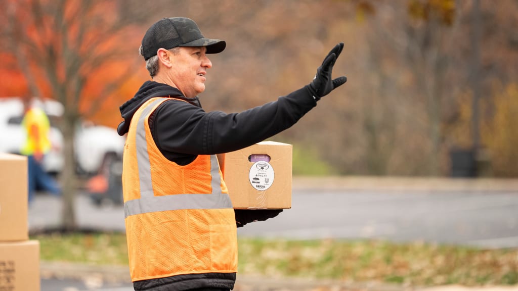 Reds general manager Brad Meador was one of the volunteers for the food distribution event.