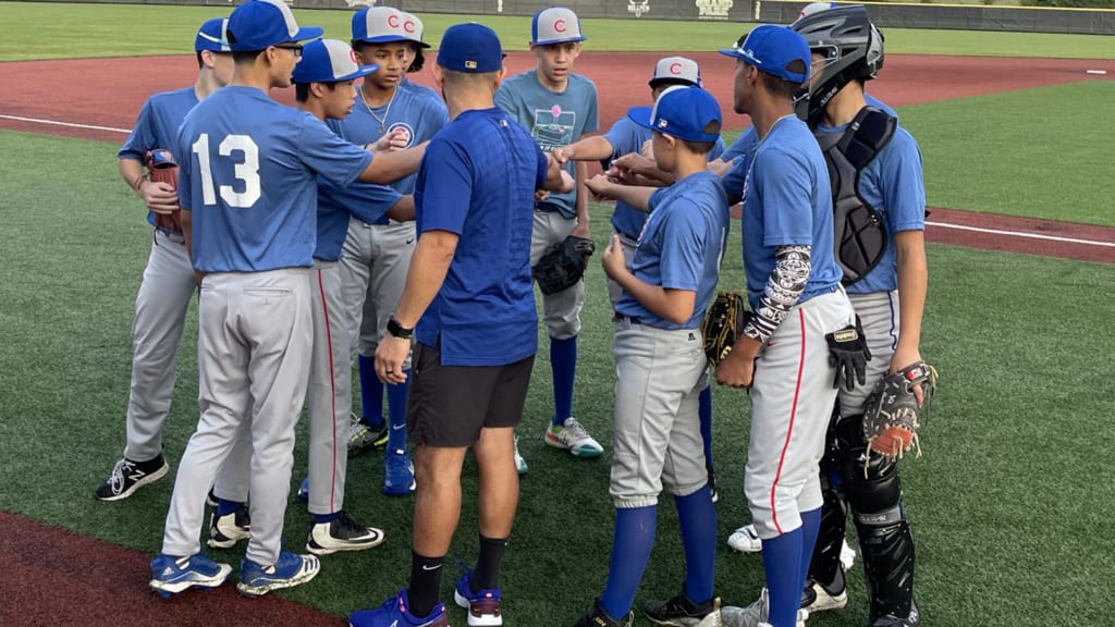 Gaston Lopez Jr. huddles with his teammates on the Cubs RBI All-Star Team.