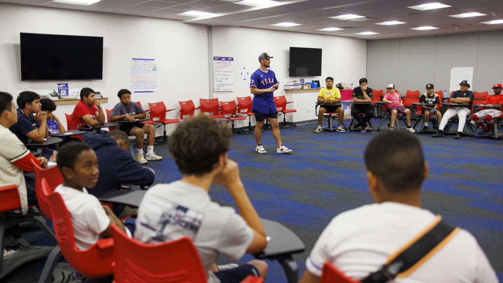 Shawn Armstrong visits with Texas Rangers Youth Academy athletes as part of the Angles in the Outfield STEM Camp presented by Lockheed Martin.