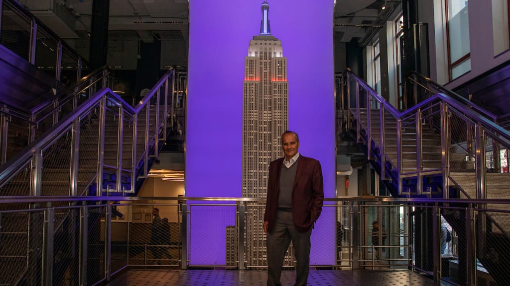 Joe Torre pauses in the Empire State Building lobby.