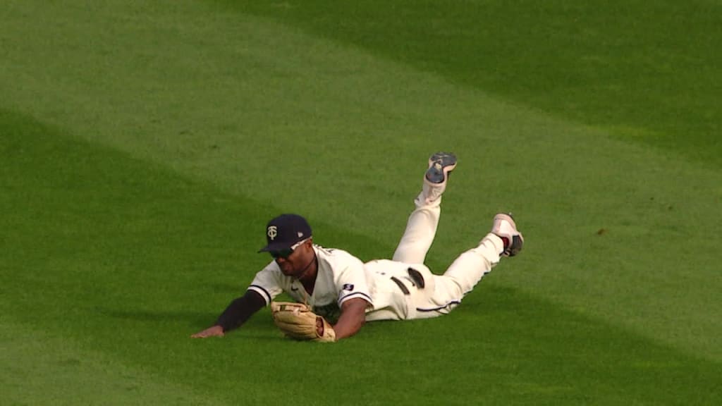 Minnesota Twins third baseman, Gary Gaetti, makes a dive at a ball