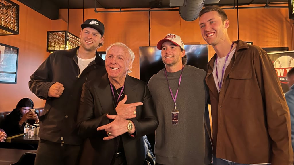 From left to right: Brewers reliever Trevor Megill, Ric Flair, Brewers second baseman Brice Turang and Brewers Opening Day starter Jacob Misiorowski