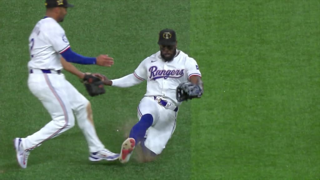 Marcus Semien, Adolis García collide in the outfield