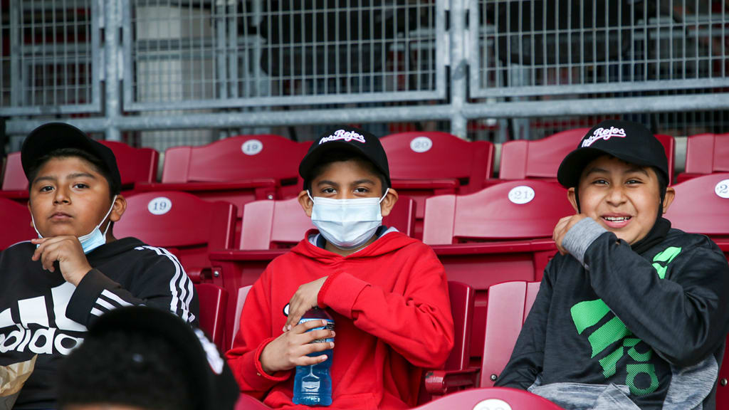 Player contributions help provide game tickets, bus transportation and food vouchers for the ballpark and “Los Rojos” hats for all the kids.