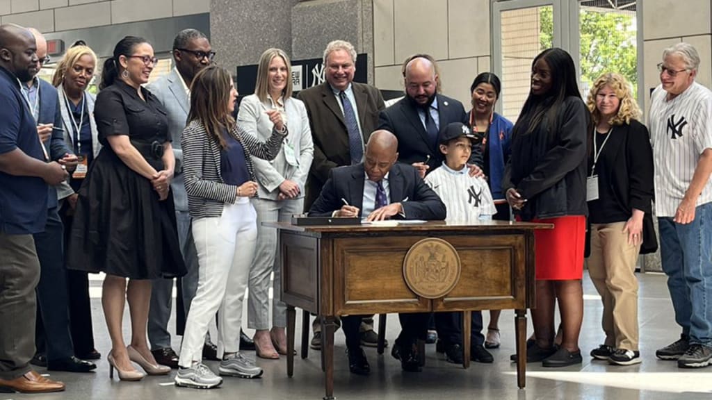 Mayor Eric Adams signing Intro. 891-A at Yankee Stadium (Photo by Bryan Hoch)