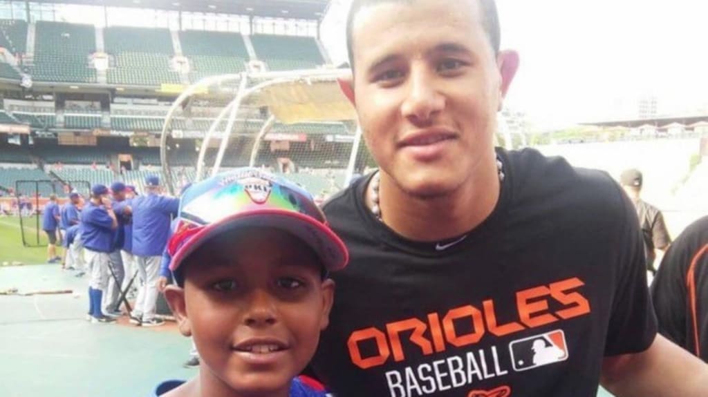 Caminero, around 14 years of age, and Manny Machado, then of the Orioles, on a youth league team visit to Camden Yards (Photo courtesy Junior Caminero)