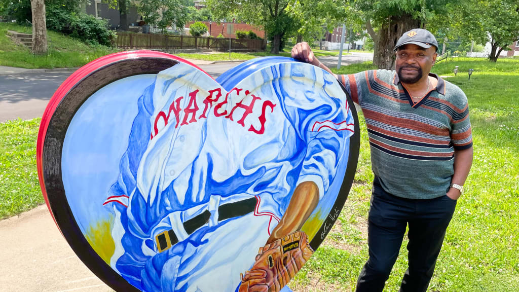 Anthony High adapted his watercolor "Monarch Glove" to fit one side of his "Negro Baseball Heart" that was part of Kansas City's first Parade of Hearts. (Photo by Denny Dressman)