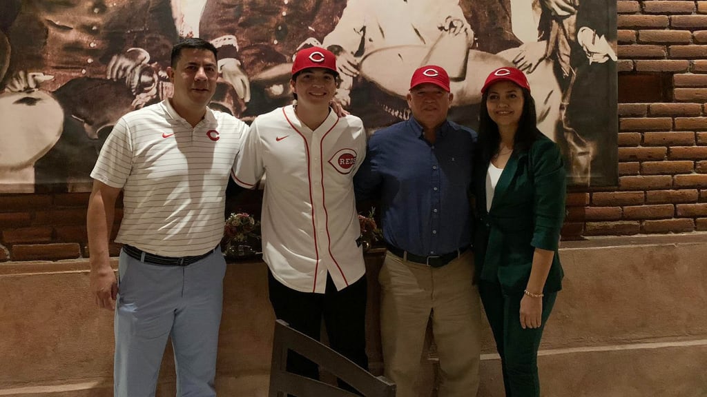 Ichiro Cano Hernandez with Reds scout Alex Ahumada (left) and parents Eugenio Cano and Syntia Hernandez.
