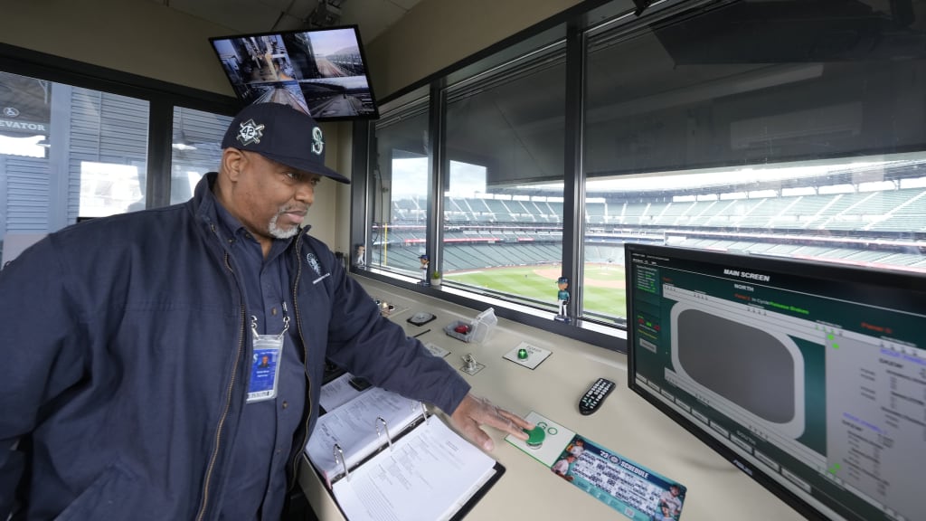 Vance Akres activates the roof’s retraction system from the center-field control booth. (Credit: Ben VanHouten)