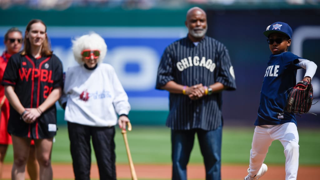 Skylar Kaplan, Maybelle Blair and William Douglas “Doug” Foster Jr. watch as Nationals Youth Academy athlete Tre throws out the first pitch.