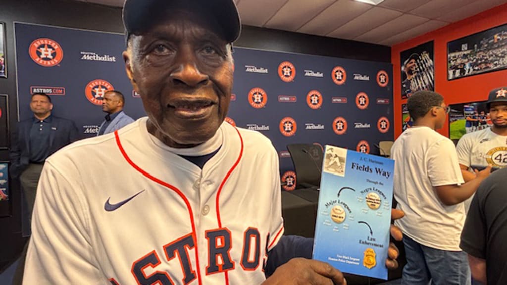 J C Hartman with his book