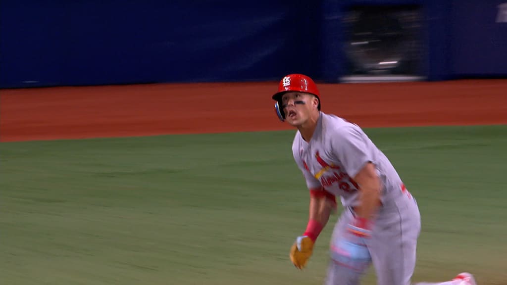 Lars Nootbaar of the St. Louis Cardinals beats the tag by Ramon