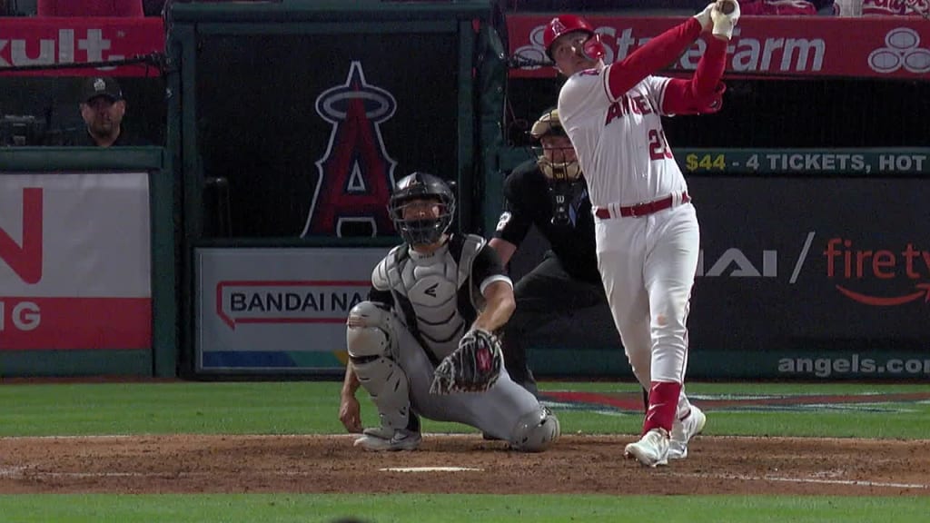 Los Angeles Angels pitcher Jaime Barria, right, sits in the dugout