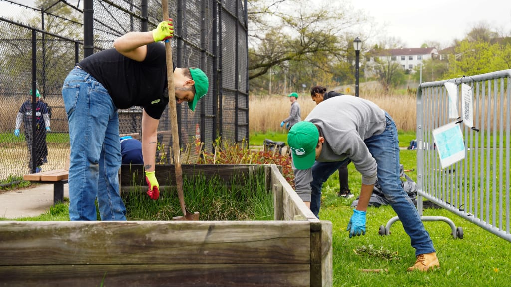 Prior to the cleanup event, many volunteers had visited Corona Park to run or attend family events. (Photo by Mary DeCicco/MLB Photos)