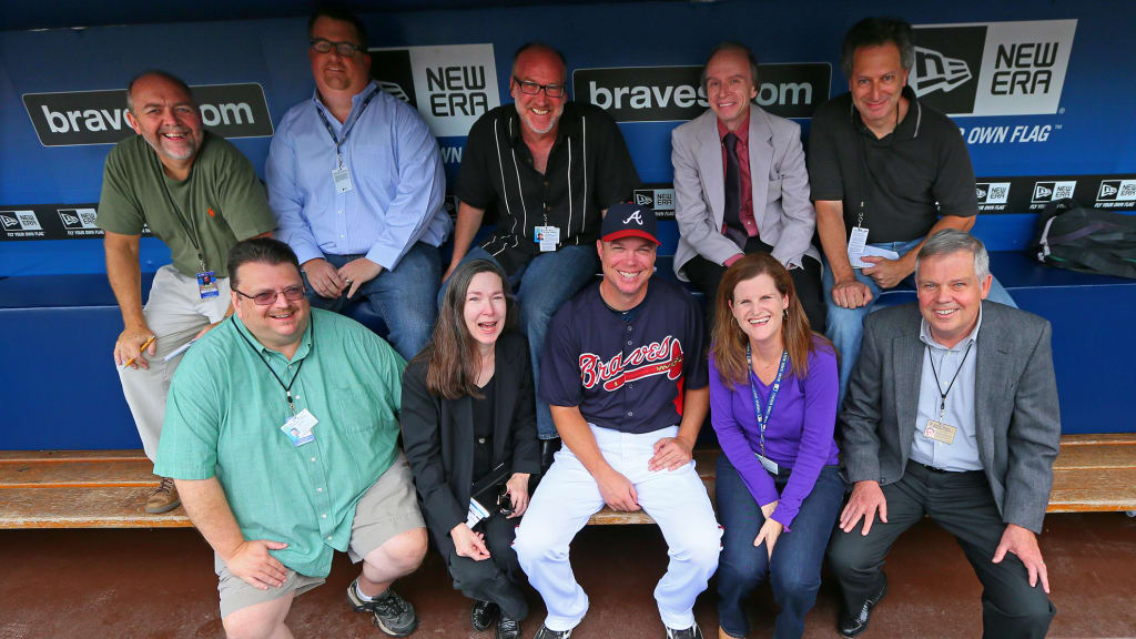 Ray Glier (left, top row) and members of the Atlanta beat pose for a photo with Chipper Jones. (Courtesy of Ray Glier)