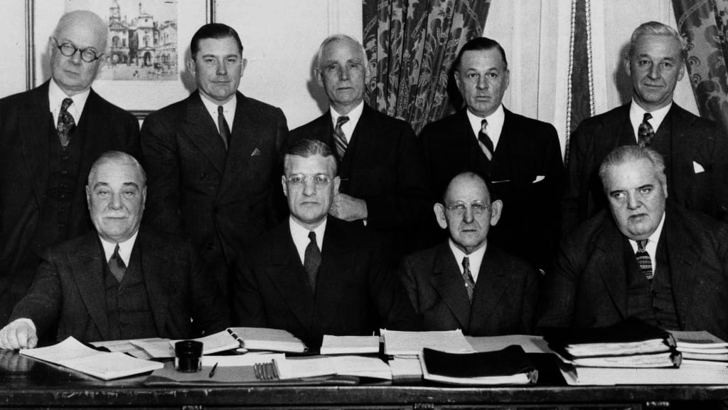 American League baseball team owners pose with the League president as they assembled for the annual meeting at the Hotel Commodore in New York City, Dec. 11, 1934