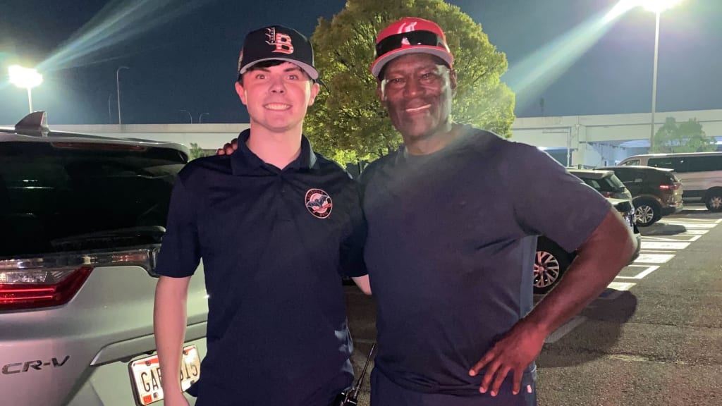 Oxley poses with Reds legend George Foster, following Sept. 10's Louisville Bats game.