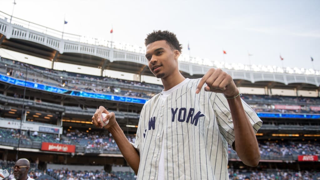 Likely NBA top pick Wembanyama throws baseball with Yankees