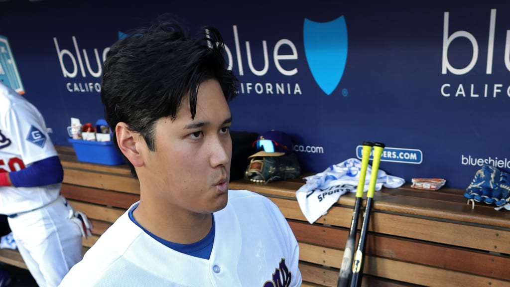 Shohei Ohtani in the Dodgers dugout on Opening Day with his "techno-cut" hairstyle.