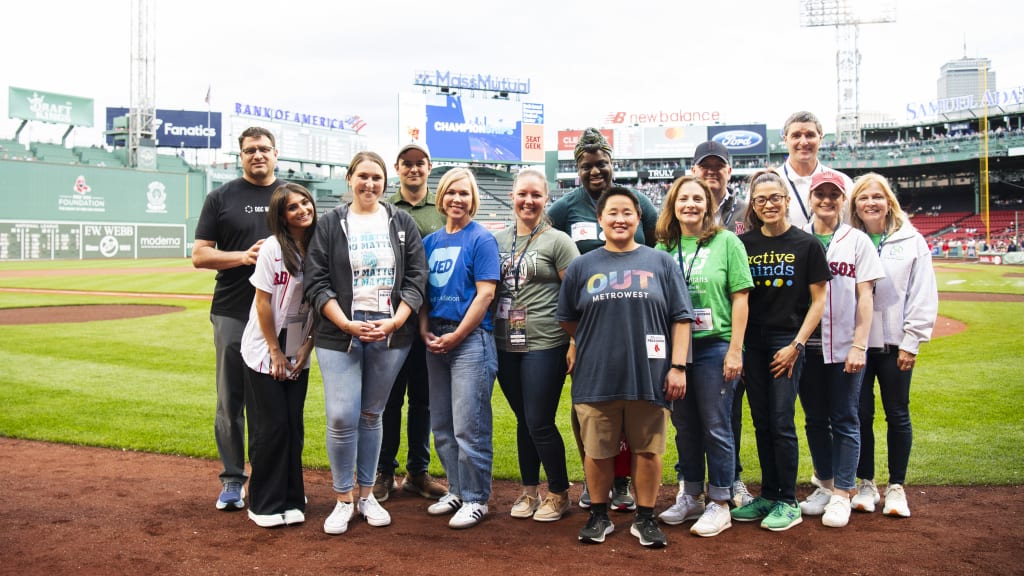 Members of the Red Sox's Changeup the Conversation initiative pose for a pregame photo.