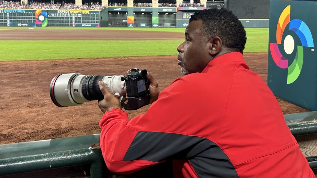 Ken Griffey Jr. photographing the 2026 World Baseball Classic