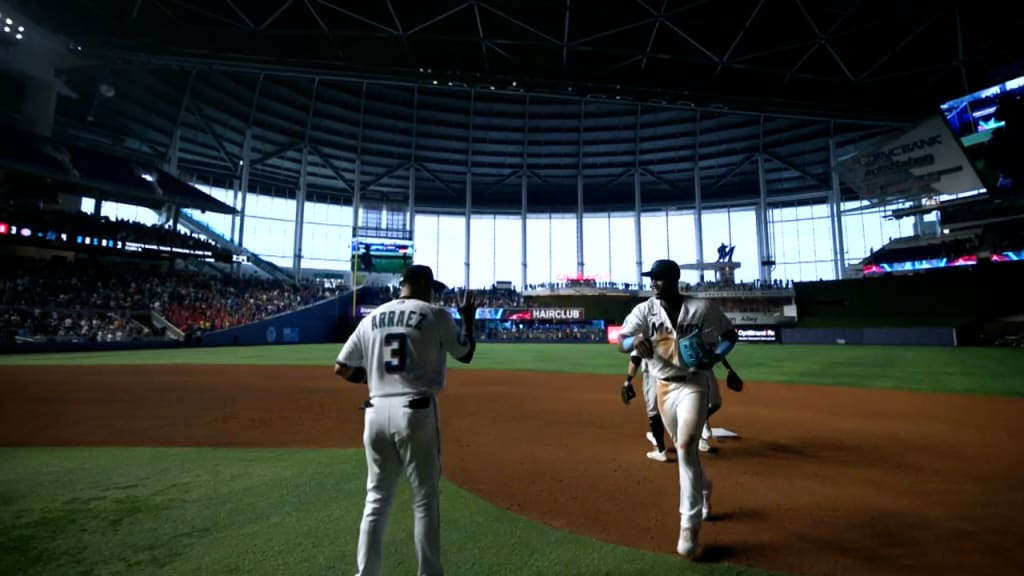 Luis Arraez of the Miami Marlins, congratulates Johnny Cueto of