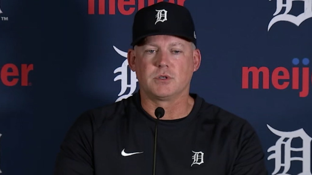 A Detroit Tigers hat and glove rest in the dugout in an MLB game