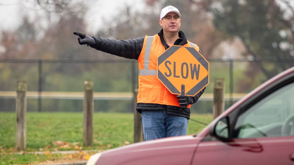Radio broadcaster Tommy Thrall helped direct people through the parking lot.