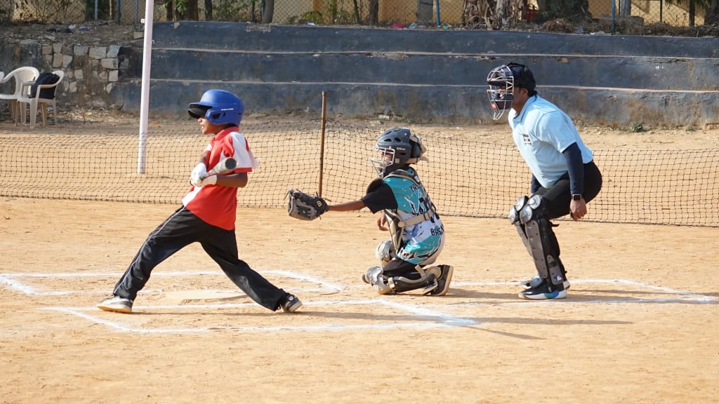 A young ballplayer takes a swing. Photo courtesy of MLB India.