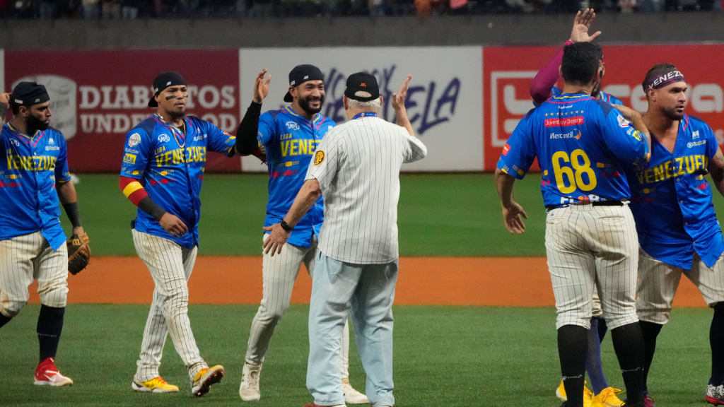 Venezuela's players celebrate after defeating Colombia.