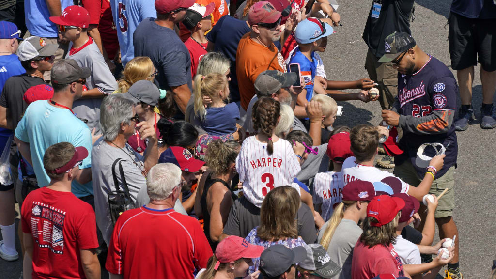 Dominic Smith signs autographs for fans attending the Little League World Series.