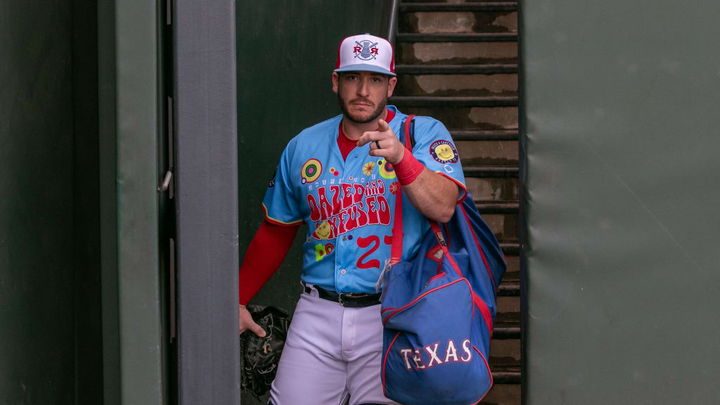 Round Rock catcher Jordan Procyshen points in his Dazed and Confused jersey.