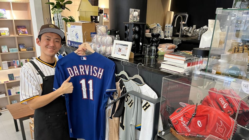 Kwang-Hee Lee shows off his collection of Yu Darvish jerseys -- plus the red glove.