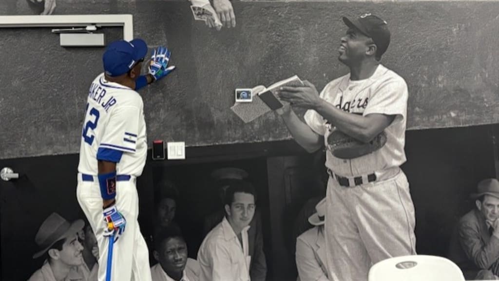 Dusty Baker standing in front of a Jackie Robinson mural at Dodgertown, where he spent eight springs as a player.