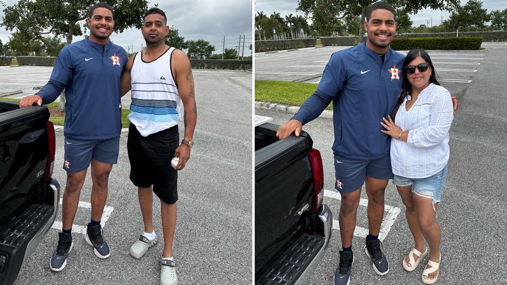 Nehomar Ochoa Jr. stands with his father, Nehomar Ochoa (left), and stepmother, Indira Ochoa (right), the day after he received his stitches at the Astros' Sprint Training complex in West Palm Beach, Fla.