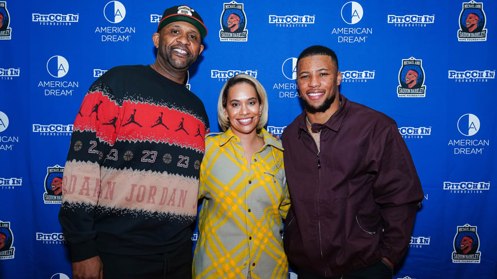 CC and Amber Sabathia worked in partnership with New York Giants running back Saquon Barkley and his foundation (Denis Kennedy/MLB)
