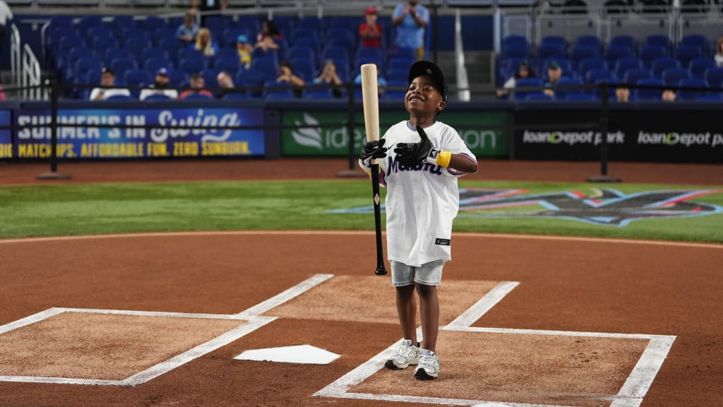 Malachi Jenkins swung Agustín Ramírez’s bat during a pregame ceremony.