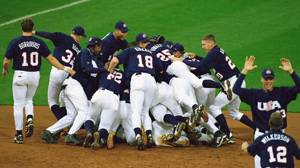 Team USA celebrates on the field after defeating Cuba for the team's first Olympic gold medal.