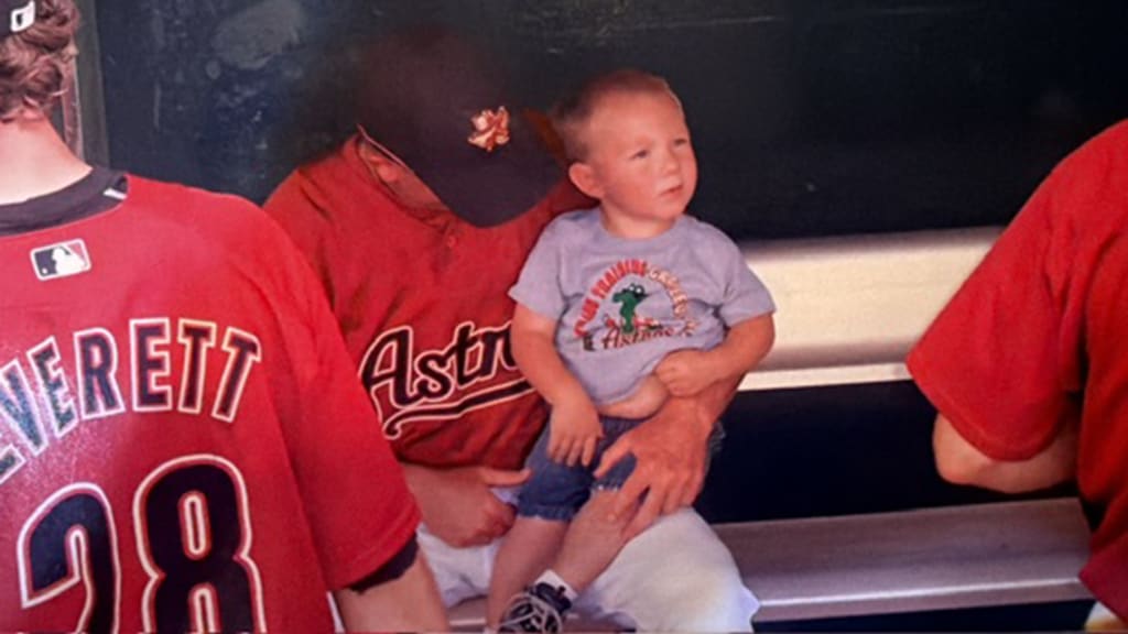 Young Logan Hughes in the Astros' dugout during Spring Training in Kissimmee, Fla.