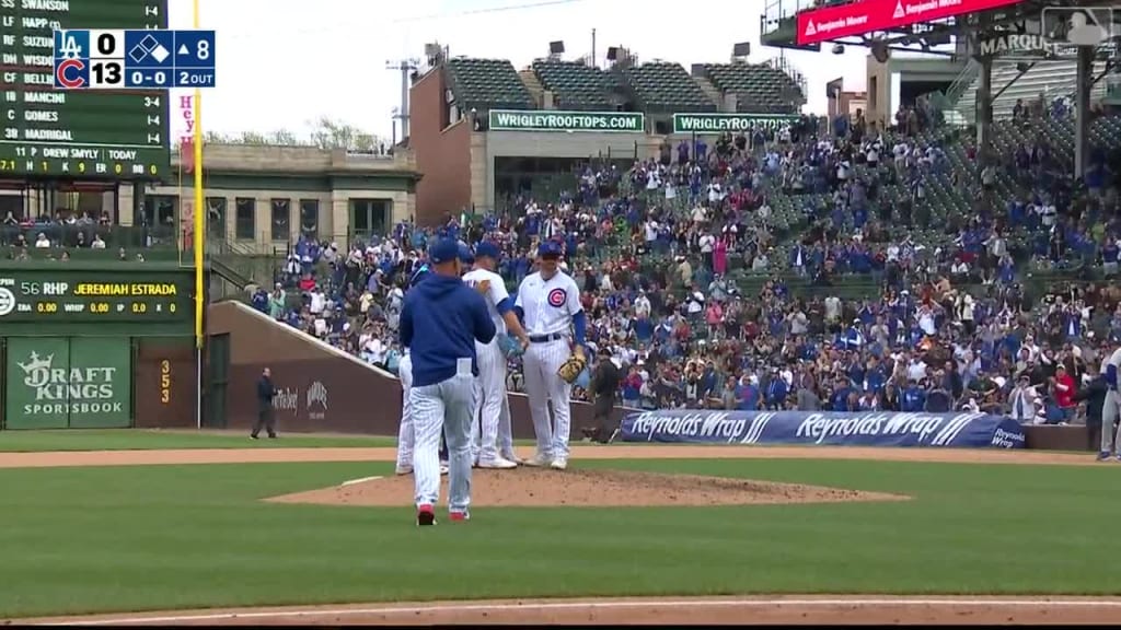 Cubs catcher Yan Gomes wears football helmet after perfect game tackle