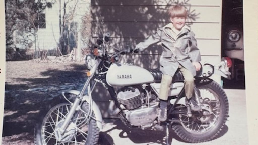 Young Jim Abbott sitting on a motorcycle (Courtesy of Abbott family)