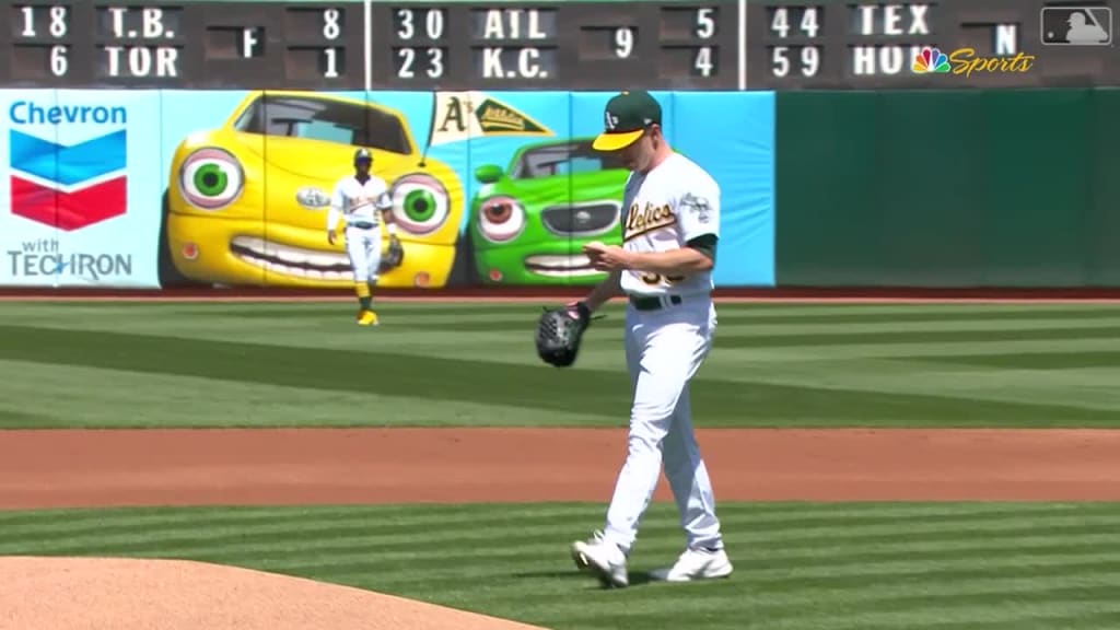 Former Oakland Athletics player Reggie Jackson throws out the ceremonial  first pitch after a ceremony honoring the Athletics' 1973 World Series  championship team before a baseball game between the Athletics and the