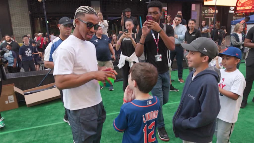 Francisco Lindor talks with a young baseball fan at a PLAY BALL outreach event