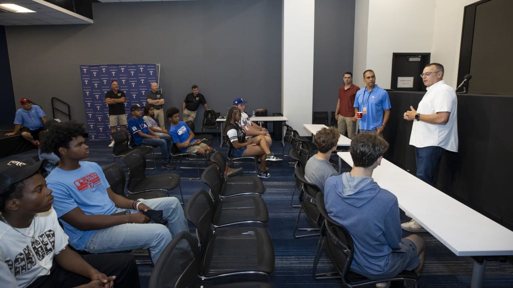 MLB umpires Andy Fletcher, Gabe Morales and Willie Trayno meet with athletes from the Texas Rangers Youth Academy.