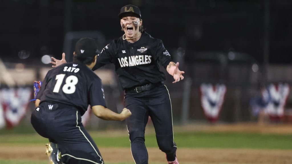 Ayami Sato and Ashton Lansdell celebrate the last out of the game.