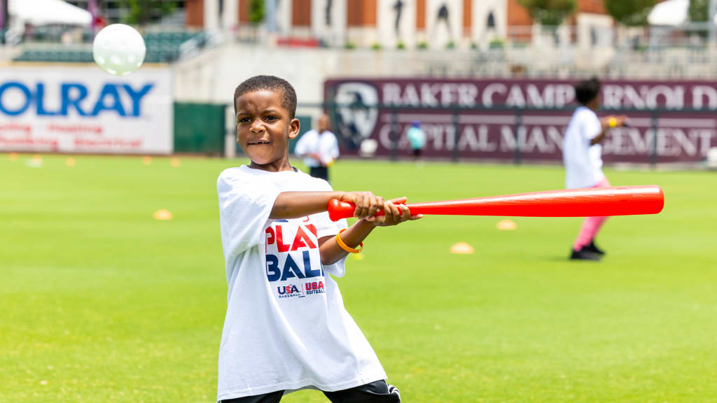 Play Ball participants take part in hitting drills at Regions Field.