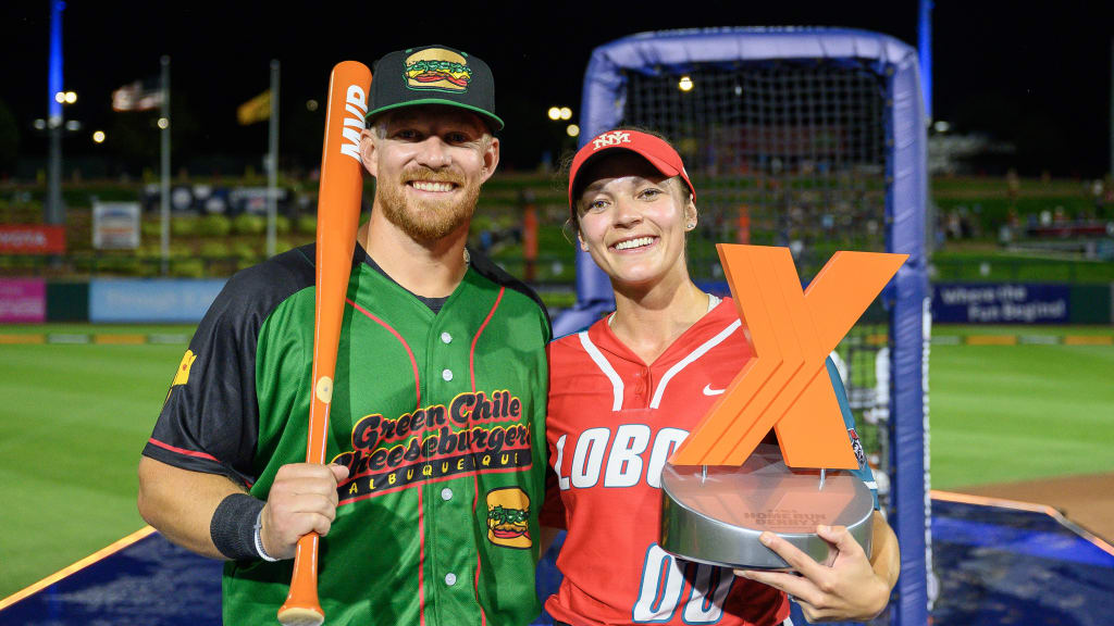 Jared Mang with his MVP Award bat, left, with his fiancee Andrea Howard holding the HRDX trophy.