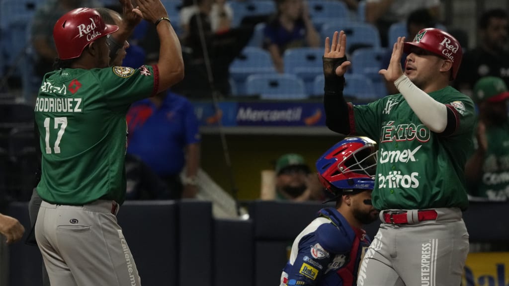 Reynaldo Rodriguez (left) and Rodolfo Amador celebrate after scoring vs. Venezuela. (Fernando Llano/AP)